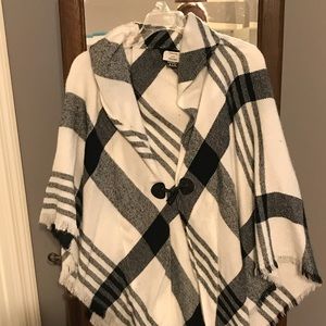 One size poncho, black and white plaid.